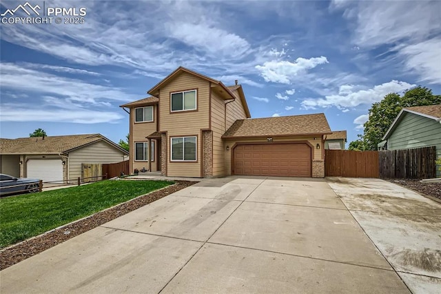 1155 Hallamwood Dr, Colorado Springs, CO 80911 - traditional home featuring an attached garage and driveway