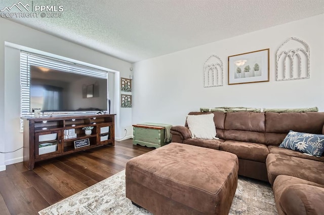 1155 Hallamwood Dr, Colorado Springs, CO 80911 - living area with dark wood-style floors, a textured ceiling, and baseboards