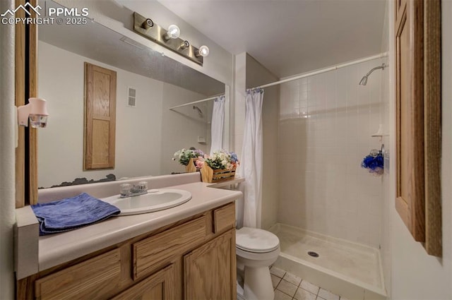 6938 Big Timber Dr, Colorado Springs, CO 80923 - bathroom featuring vanity, tile patterned flooring, toilet, and a tile shower