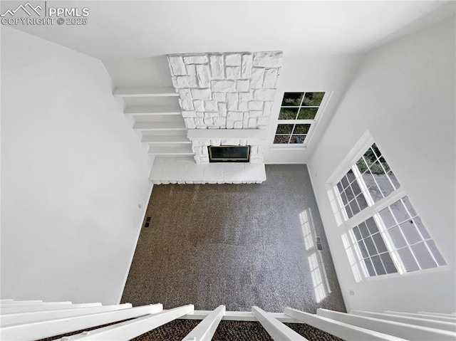412 Cobblestone Dr, Colorado Springs, CO 80906 - unfurnished living room featuring a stone fireplace