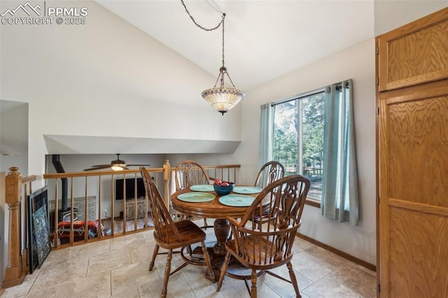 14810 Tanner Trl, Elbert, CO 80106 - dining space featuring lofted ceiling, a ceiling fan, and baseboards