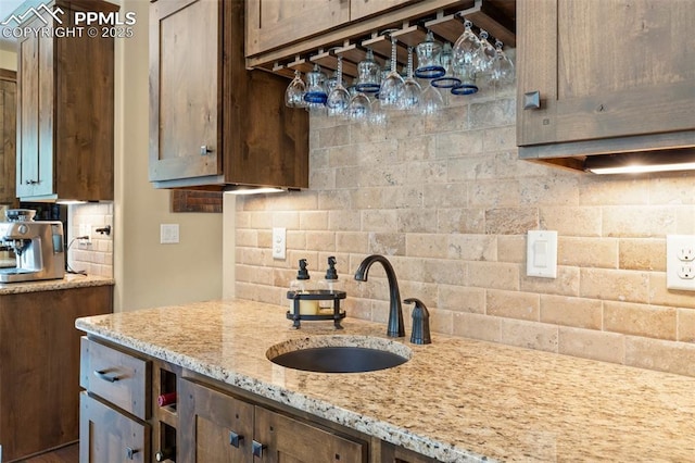 11720 Smokey Hill Grv, Colorado Springs, CO 80908 - kitchen with tasteful backsplash and light stone countertops