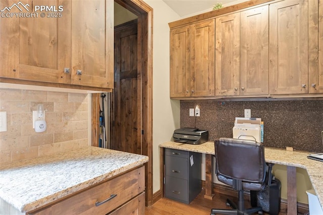 11720 Smokey Hill Grv, Colorado Springs, CO 80908 - home office featuring built in desk and light wood-type flooring