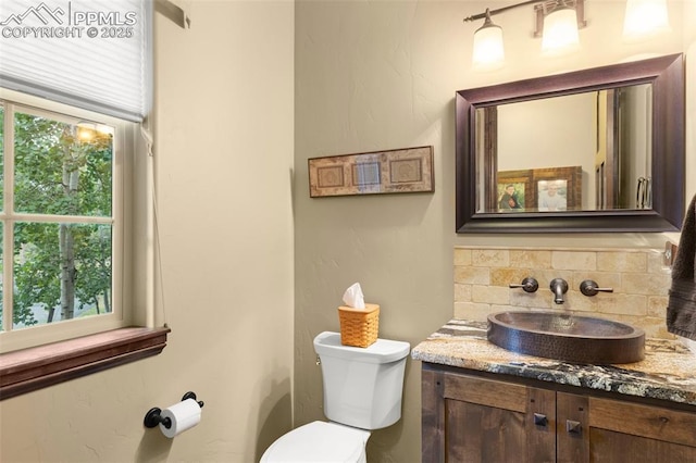 11720 Smokey Hill Grv, Colorado Springs, CO 80908 - bathroom with vanity and decorative backsplash