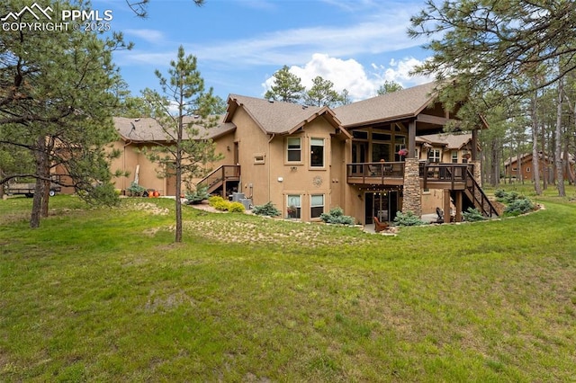 11720 Smokey Hill Grv, Colorado Springs, CO 80908 - rear view of house with stairs, stucco siding, a deck, and a yard