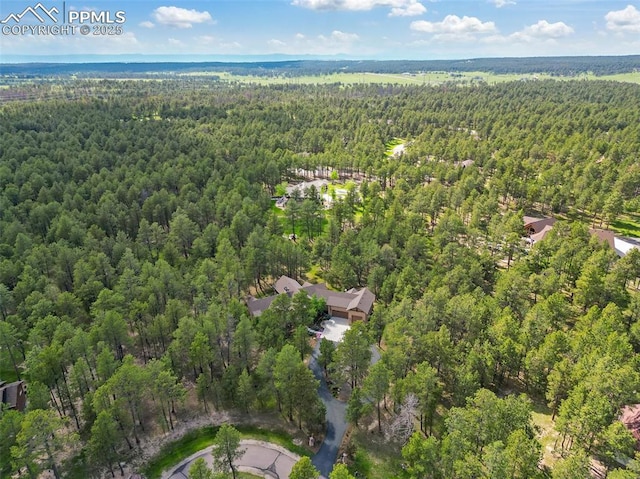 11720 Smokey Hill Grv, Colorado Springs, CO 80908 - aerial view of property and surrounding area with a heavily wooded area