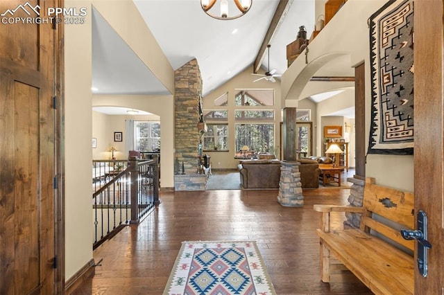11720 Smokey Hill Grv, Colorado Springs, CO 80908 - foyer entrance with arched walkways, hardwood / wood-style floors, a ceiling fan, beam ceiling, and high vaulted ceiling