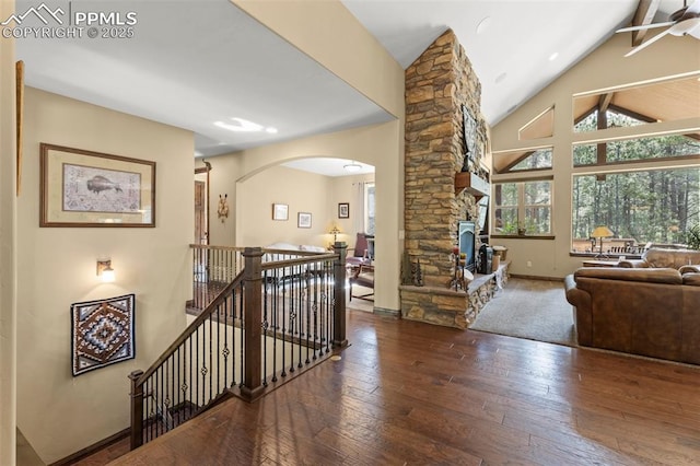 11720 Smokey Hill Grv, Colorado Springs, CO 80908 - staircase featuring hardwood / wood-style floors, arched walkways, high vaulted ceiling, and a ceiling fan