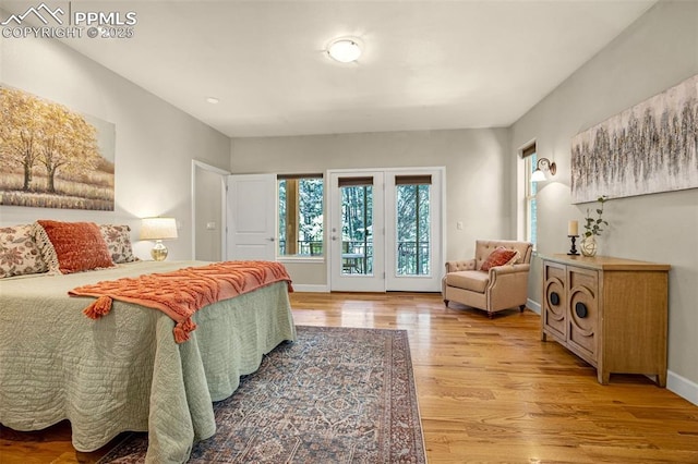 4775 Neeper Valley Rd, Manitou Springs, CO 80829 - bedroom with access to outside, light wood-style flooring, and baseboards