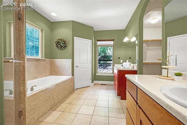 4775 Neeper Valley Rd, Manitou Springs, CO 80829 - bathroom featuring two vanities, a garden tub, tile patterned flooring, a stall shower, and a closet