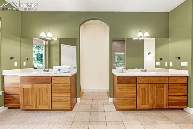 4775 Neeper Valley Rd, Manitou Springs, CO 80829 - bathroom with two vanities, baseboards, and tile patterned flooring