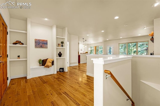 4775 Neeper Valley Rd, Manitou Springs, CO 80829 - corridor with an upstairs landing, light wood-style floors, plenty of natural light, recessed lighting, and baseboards