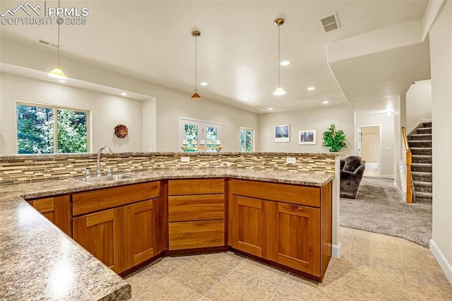 4775 Neeper Valley Rd, Manitou Springs, CO 80829 - kitchen with a sink, brown cabinetry, recessed lighting, plenty of natural light, and backsplash