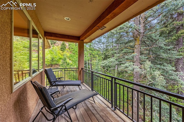 4775 Neeper Valley Rd, Manitou Springs, CO 80829 - wooden terrace with a wooded view