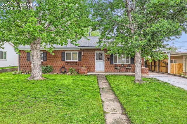 2227 Farragut Ave, Colorado Springs, CO 80907 - view of front of house with brick siding and roof with shingles