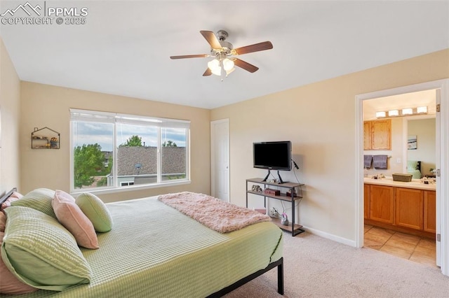6755 Akerman Dr, Colorado Springs, CO 80923 - bedroom with light carpet, baseboards, ensuite bathroom, and a ceiling fan