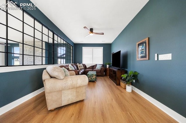 455 Rogers Way, Castle Rock, CO 80104 - living area featuring a ceiling fan, wood finished floors, and baseboards