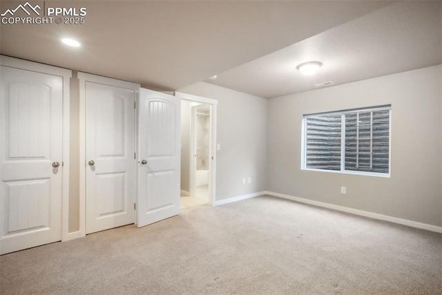6015 Trappers Tale Ct, Colorado Springs, CO 80923 - unfurnished bedroom featuring carpet flooring, baseboards, and connected bathroom
