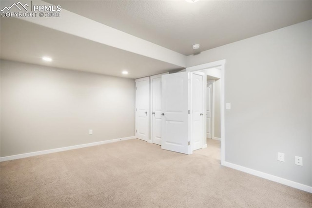 6015 Trappers Tale Ct, Colorado Springs, CO 80923 - unfurnished bedroom featuring light colored carpet, baseboards, and recessed lighting