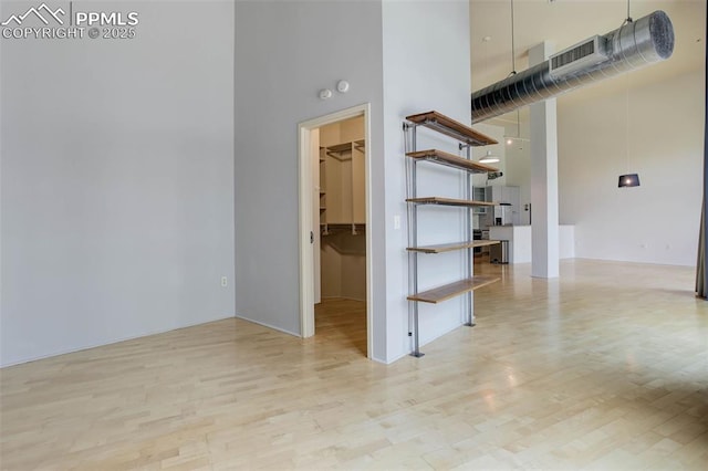 3100 Huron St Unit 4N, Denver, CO 80202 - unfurnished room with a towering ceiling and wood finished floors