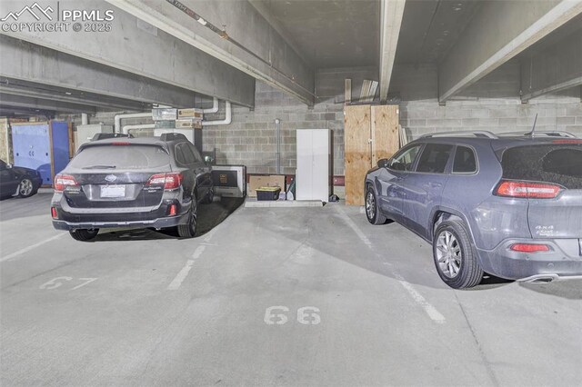 3100 Huron St Unit 4N, Denver, CO 80202 - parking deck featuring concrete block wall