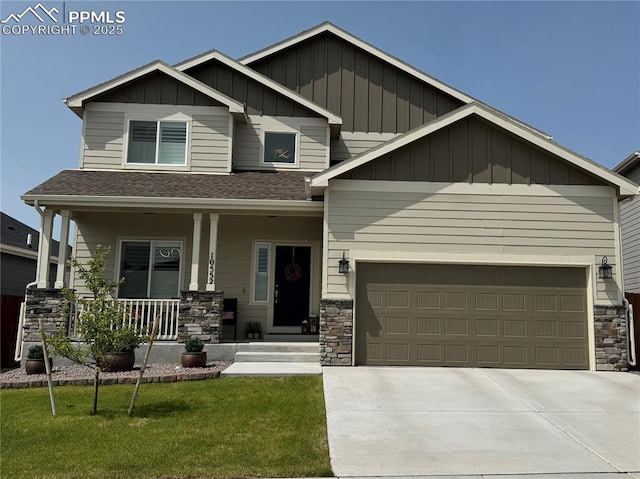 10552 Summer Ridge Dr, Peyton, CO 80831 - craftsman-style home featuring board and batten siding, a porch, stone siding, and a shingled roof