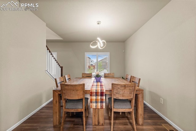 10552 Summer Ridge Dr, Peyton, CO 80831 - dining area with a chandelier, dark wood-style flooring, baseboards, and stairs