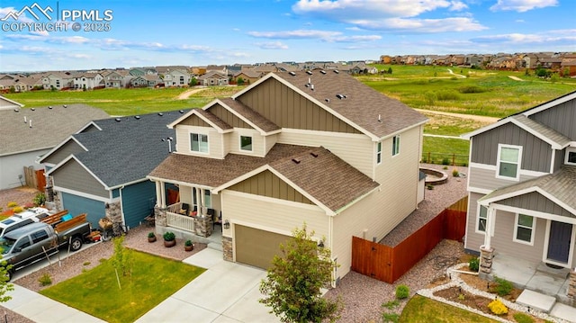 10552 Summer Ridge Dr, Peyton, CO 80831 - view of front of property with a shingled roof, a residential view, board and batten siding, and concrete driveway