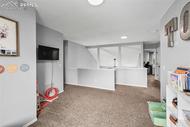 2280 Lisa Dr, Colorado Springs, CO 80915 - playroom featuring carpet flooring, baseboards, and a textured ceiling