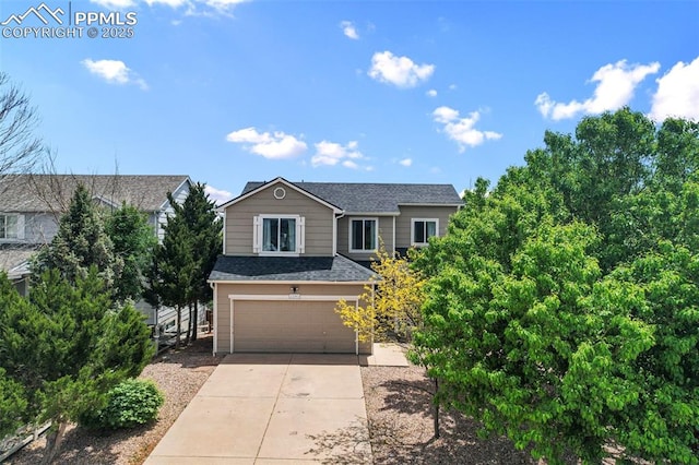2280 Lisa Dr, Colorado Springs, CO 80915 - traditional-style home featuring a garage, concrete driveway, and a shingled roof