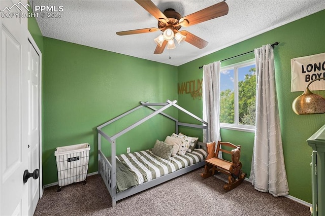 2280 Lisa Dr, Colorado Springs, CO 80915 - carpeted bedroom featuring a ceiling fan, a textured ceiling, a closet, and baseboards