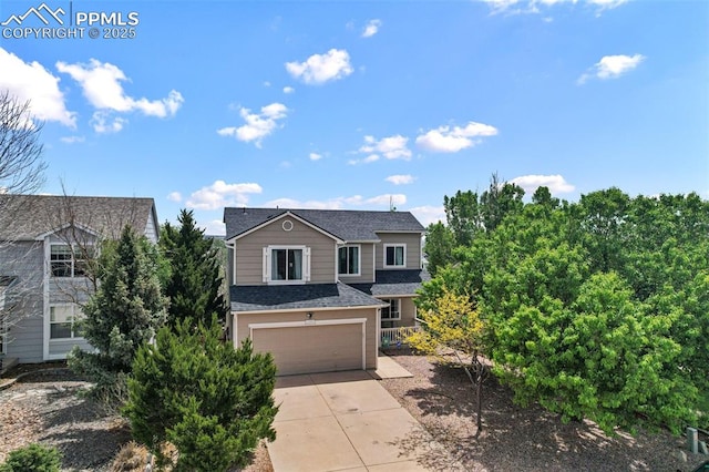 2280 Lisa Dr, Colorado Springs, CO 80915 - traditional home with an attached garage, concrete driveway, and a shingled roof