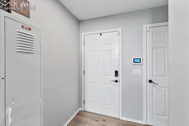 2280 Lisa Dr, Colorado Springs, CO 80915 - foyer with wood finished floors and baseboards