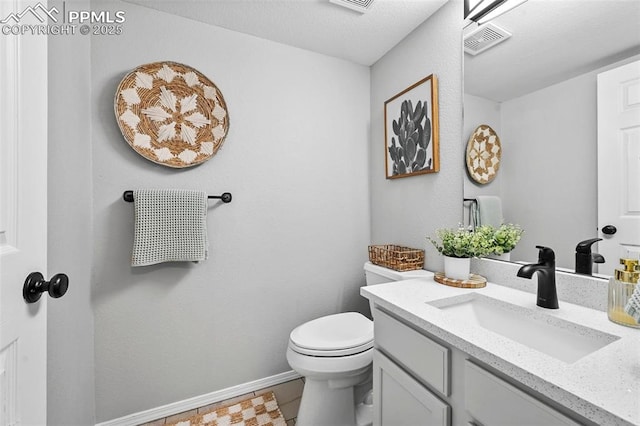 2280 Lisa Dr, Colorado Springs, CO 80915 - half bath with vanity, toilet, and baseboards