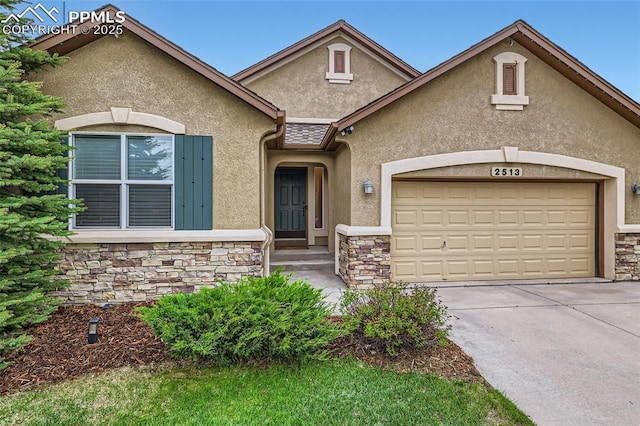 2513 Cinnabar Rd, Colorado Springs, CO 80921 - view of front of property featuring stone siding, stucco siding, driveway, and an attached garage