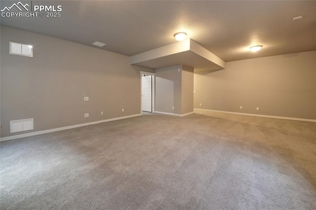 4228 Notch Trl, Colorado Springs, CO 80924 - finished basement with baseboards, carpet, and a textured ceiling