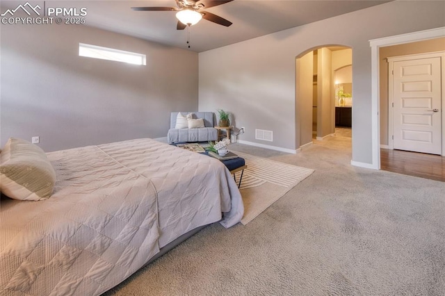 4228 Notch Trl, Colorado Springs, CO 80924 - carpeted bedroom with arched walkways, baseboards, and a ceiling fan