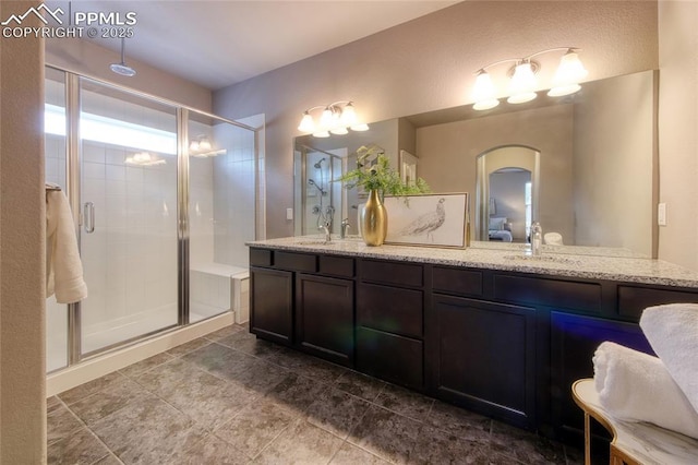 4228 Notch Trl, Colorado Springs, CO 80924 - bathroom featuring a stall shower and double vanity