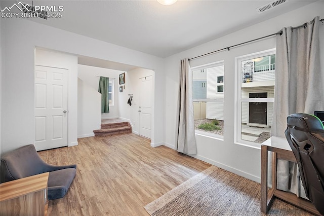 5840 Thurless Ln, Colorado Springs, CO 80927 - living area featuring healthy amount of natural light, wood finished floors, and baseboards