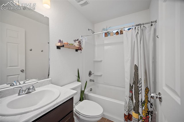 5840 Thurless Ln, Colorado Springs, CO 80927 - full bathroom with shower / tub combo, vanity, toilet, and a textured wall