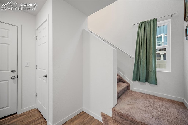 5840 Thurless Ln, Colorado Springs, CO 80927 - stairway with wood finished floors and baseboards