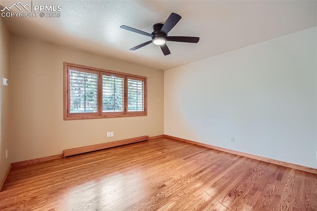 14820 Spiritwood Loop, Elbert, CO 80106 - unfurnished room with baseboard heating, light wood-style flooring, and ceiling fan