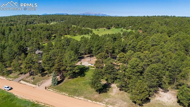 14820 Spiritwood Loop, Elbert, CO 80106 - drone / aerial view of a heavily wooded area and a mountainous background