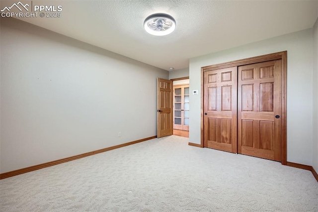 14820 Spiritwood Loop, Elbert, CO 80106 - unfurnished bedroom featuring carpet floors and a textured ceiling