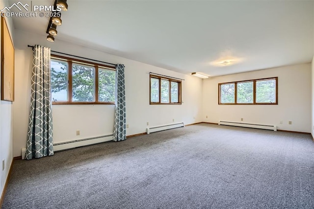 14820 Spiritwood Loop, Elbert, CO 80106 - spare room featuring baseboard heating, a baseboard heating unit, a baseboard radiator, and carpet flooring