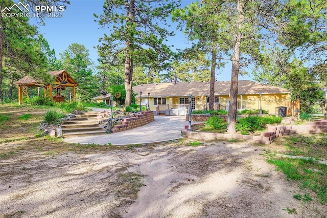 14820 Spiritwood Loop, Elbert, CO 80106 - back of house with a gazebo and a patio
