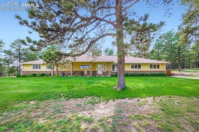 14820 Spiritwood Loop, Elbert, CO 80106 - ranch-style house featuring a front lawn and stone siding