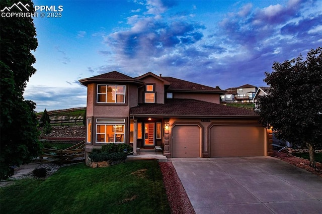 12265 Jones Park Ct, Colorado Springs, CO 80921 - traditional-style home with an attached garage, driveway, stucco siding, and a front yard