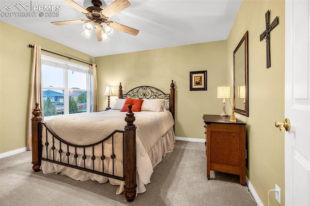 12265 Jones Park Ct, Colorado Springs, CO 80921 - bedroom featuring light carpet, baseboards, and a ceiling fan