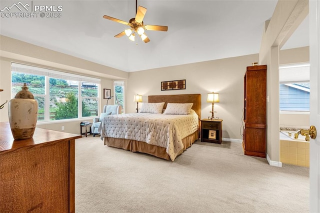 12265 Jones Park Ct, Colorado Springs, CO 80921 - bedroom with light carpet, baseboards, lofted ceiling, and a ceiling fan